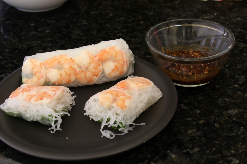 Boiled Shrimp, Boiled Bacon strip, rive vermicelli, and spinach together in banh trang (rice paper).  Accompanied with dipping sauce.